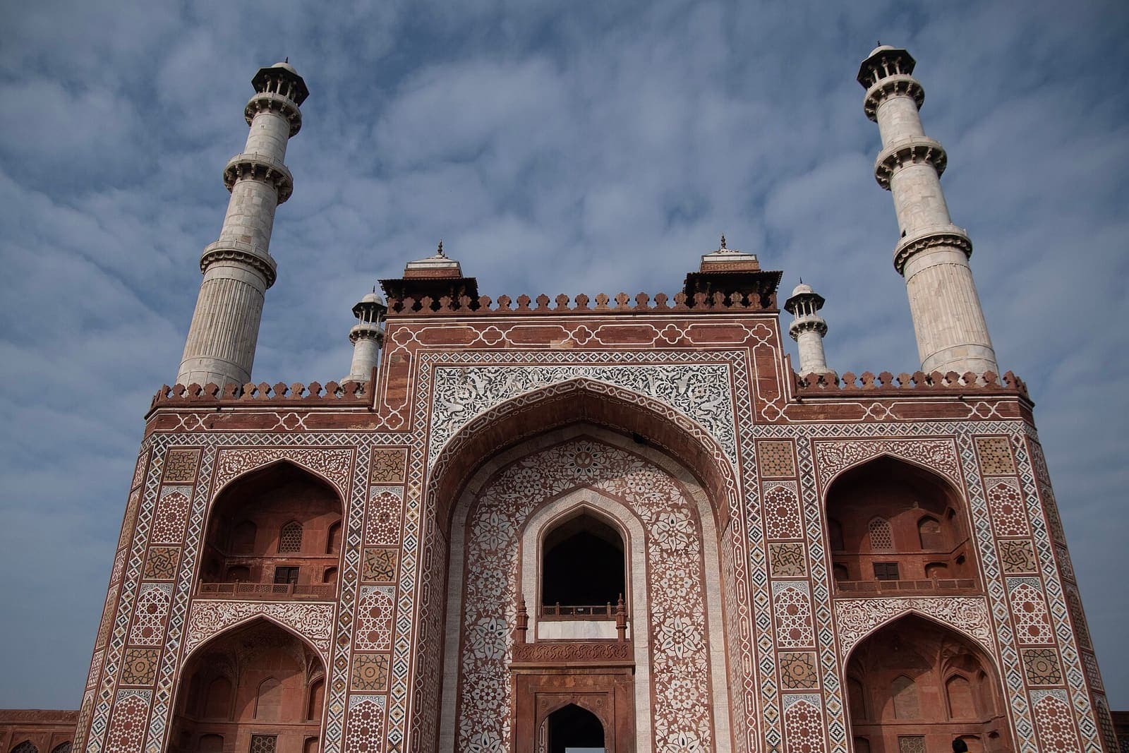 The red sandstone gateway to Akbar’s tomb at Sikandra, topped with white marble minarets