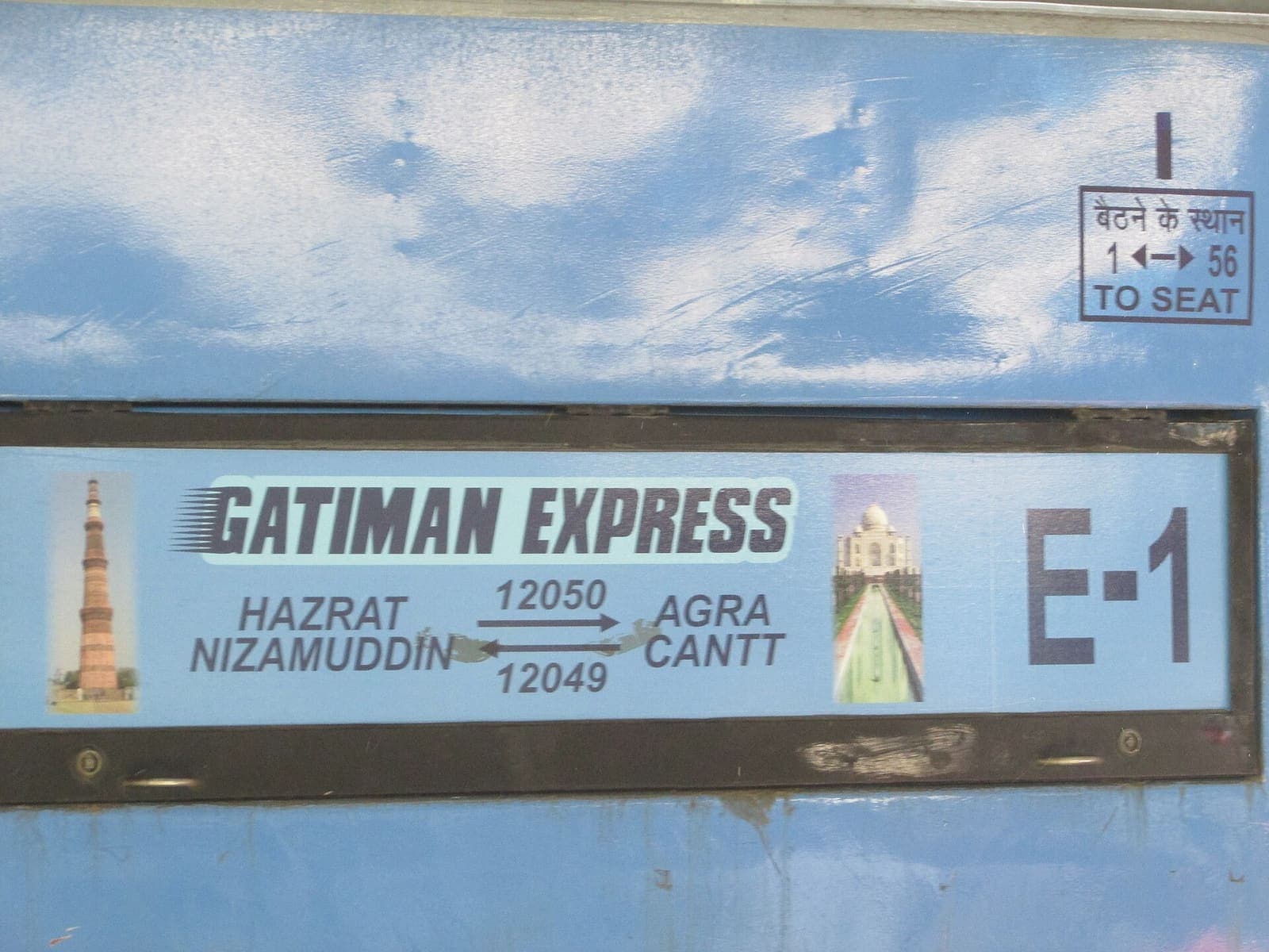 The destination board on a blue Gatimaan Express coach, reading Hazrat Nizamuddin and Agra Cantt with the train numbers 12050 and 12049