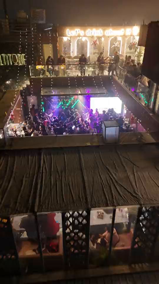 From the full dance floor up and out to the whole building on MG Road 2: the Altitude roof at the top, the floors below, Domino’s and the parked bikes at the street